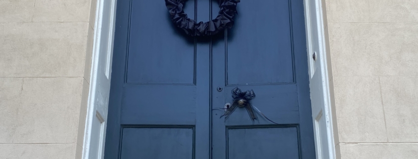 Black wreath on door - a 19th century Victorian tradition to indicate a family was in mourning