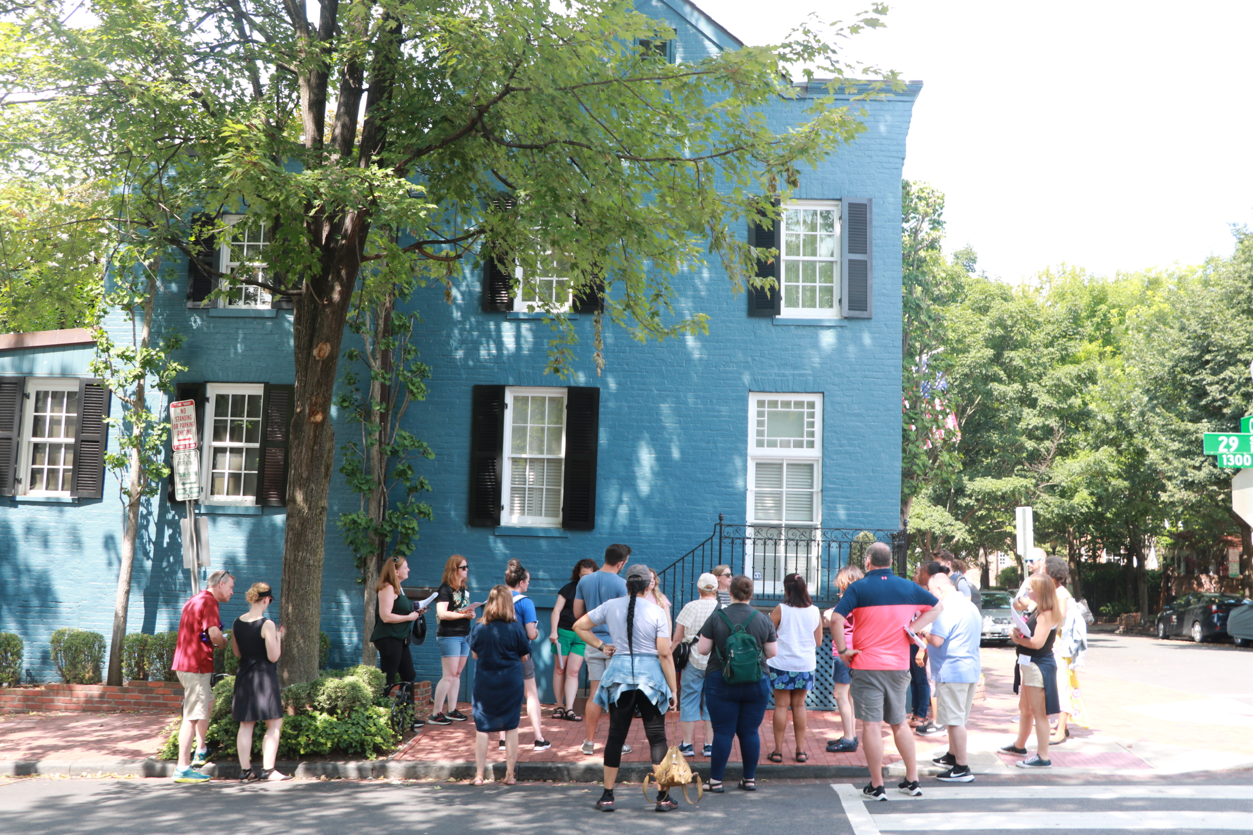 Civil War Washington Teachers surround the blue house in Georgetown