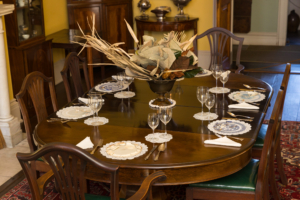 Ancestral Spaces - Dining Table set with ancestral centerpiece and shards of table ware